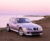 AUT 01 RK0069 04
1999 BMW M Coupe Roadster Silver 3/4 Front View On Dirt By Water Filtered