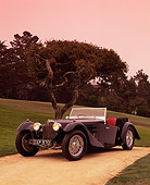 AUT 02 RK0045 12
1937 Bugatti Type 57S Convertible Black 3/4 Front View On Sand By Grass And Tree Pebble Beach