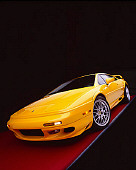 AUT 04 RK0087 05
2002 Lotus Esprit Turbo V8 25th Anniversary Edition Yellow Wide Angle 3/4 Front View On Red Floor Studio