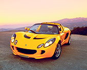 AUT 04 RK0121 03
2003 Lotus Elise Yellow 3/4 Front View On Pavement Mountains Background