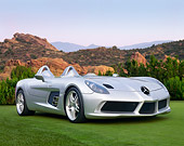 AUT 05 BK0001 01
2009 Mercedes-Benz McLaren SLR Stirling Moss Roadster Silver 3/4 Front View On Grass