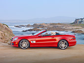AUT 05 RK0624 01
2010 Mercedes-Benz SL500 Convertible Red Profile View On Beach By Houses