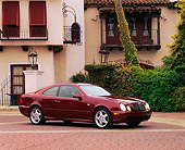 AUT 05 RK0140 05
1999 Mercedes Benz CLK 430 Sport Coupe Bordeaux Red Side 3/4 View By Spanish Building