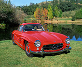 AUT 05 RK0219 01
1955 Mercedes Benz 300SL Gullwing Coupe Red 3/4 Front View On Grass By Water And Trees