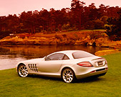 AUT 05 RK0371 01
2005 Mercedes-Benz SLR McLaren Silver 3/4 Rear View On Grass By Water Filtered