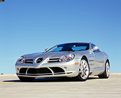 AUT 05 RK0428 05
2005 Mercedes-Benz SLR McLaren Silver Low 3/4 Front View On Pavement Blue Sky