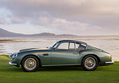 AUT 06 RK0096 01
1961 Aston Martin DB4 GT Zagato Green Profile View On Grass By Water Clouds