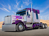 AUT 07 BK0006 01
Western Star Big Rig Purple With Flames 3/4 Front View On Pavement By Windmills
