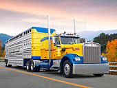 AUT 07 BK0008 01
Kenworth Big Rig Yellow And Blue 3/4 Front View On Road