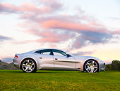 AUT 09 RK1175 01
2010 Fisker Karma Hybrid Silver Profile View On Grass