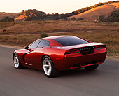 AUT 09 RK0298 02
Dodge Charger Red Concept Car 3/4 Rear View On Pavement By Dry Grass And Hills