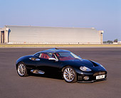 AUT 09 RK0455 01
Spyker C8 Laviolette Coupe Black 3/4 Front View On Pavement By Hangar