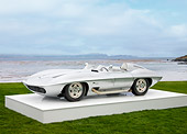 AUT 09 RK1074 01
1959 Chevrolet Corvette Stingray Racer Special Silver White 3/4 Front View On Platform On Grass
