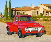 AUT 14 BK0048 01
1954 Ford F-100 Pickup Truck Red 3/4 Front View On Gravel By House
