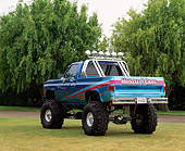 AUT 14 RK0024 03
Blue Paragon Monster Truck Rear 3/4 View On Grass Trees Background