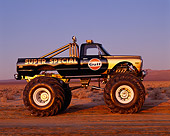 AUT 14 RK0812 05
1971 Chevrolet Monster Truck Gulf Oil Black And Gold Profile On Dirt At Dusk