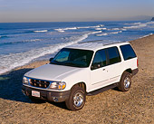 AUT 15 RK0159 03
1999 Ford Explorer White Overhead 3/4 Front View On Gravel By Ocean