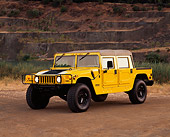 AUT 15 RK0368 08
2000 Hummer H1 Yellow 3/4 Front View On Dirt By Quarry