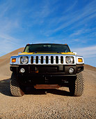 AUT 15 RK0625 09
2003 Gm H2 Hummer Yellow Wide Angle Low Head On Shot On Gravel Blue Sky