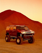 AUT 15 RK0654 03
2003 H2 Hummer Lifted Burgundy 3/4 Front View At Quarry