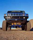 AUT 15 RK0669 01
2003 H2 Hummer Lifted Yellow Low Head On Shot On Dirt Blue Sky