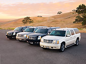 AUT 15 RK1208 01
2007, 2004, 2007 & 2004 (L-R) Cadillac Escalades 3/4 Front View By Hills