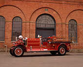 AUT 16 RK0129 01
1923 Ahrens Fox Fire Engine Red 3/4 Side View On Pavement By Brick Building