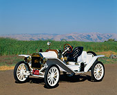 AUT 17 RK0029 17
1914 Ford Model T Speedster White 3/4 Front View On Dirt By Green Field