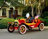 AUT 17 RK0154 01
1912 Ford Model T Red 3/4 Side View On Pavement By House