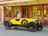 AUT 18 RK0749 01
1920 Biddle Speedway Special Yellow 3/4 Front View On Pavement By Building