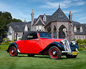 AUT 19 BK0002 01
1938 Citroen Traction Roadster Red And Black 3/4 Front View On Grass By Trees