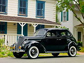 AUT 19 RK0747 01
1937 Ford Deluxe Touring Sedan Black 3/4 Front View On Pavement By House