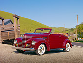 AUT 19 RK0784 01
1939 Plymouth P8 Convertible Dark Cranberry 3/4 Side View On Gravel By Barn And Grassy Hill