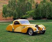 AUT 19 RK0342 02
1937 Bugatti Type 57 Atlante Coupe Yellow 3/4 Side View On Grass