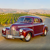 AUT 20 RK0397 01
1941 Chevrolet Special Deluxe Coupe Burgundy 3/4 Front View On Pavement By Vineyard