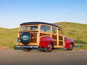 AUT 20 RK0480 01
1947 Ford Woodie Red 3/4 Rear View On Pavement By Grassy Hill