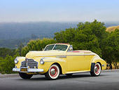 AUT 20 RK0500 01
1941 Buick 56C Convertible Sequoia Cream 3/4 Front View On Pavement By Trees