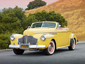 AUT 20 RK0501 01
1941 Buick 56C Convertible Sequoia Cream 3/4 Front View On Pavement By Trees