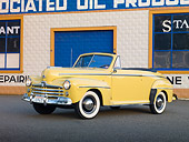 AUT 20 RK0508 01
1947 Ford Super Deluxe Convertible Yellow 3/4 Front View In Front Of Garage