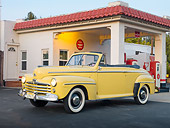 AUT 20 RK0513 01
1947 Ford Super Deluxe Convertible Yellow 3/4 Front View In Gas Station