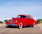 AUT 20 RK0117 10
1941 Red Packard 160 Deluxe Convertible 3/4 Front View On Road