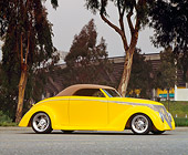 AUT 20 RK0132 07
1940 Yellow Ford Custom Coupe 3/4 Front View On Pavement By Trees