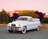 AUT 20 RK0218 02
1941 Packard Flower Car White 3/4 Front View On Pavement By Trees Filtered