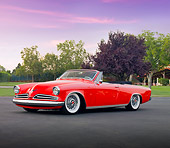 AUT 21 RK2534 01
1953 Studebaker Commander Convertible Red 3/4 Front View On Pavement By Trees