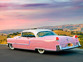 AUT 21 RK2554 01
1955 Cadillac Coupe de Ville Pink 3/4 Rear View On Pavement By Valley