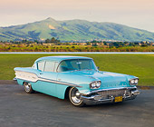 AUT 21 RK2605 01
1958 Pontiac Chieftain Turquoise 3/4 Front View On Pavement By Grass