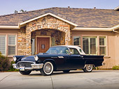 AUT 21 RK2653 01
1957 Ford Thunderbird Black 3/4 Front View On Pavement By House