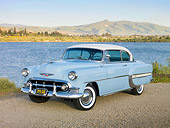 AUT 21 RK2702 01
1953 Chevrolet Bel Air Blue And White 3/4 Front View On Gravel By Lake