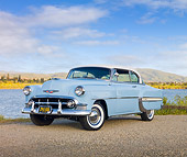 AUT 21 RK2703 01
1953 Chevrolet Bel Air Blue And White 3/4 Front View On Gravel By Lake