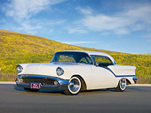 AUT 21 RK2714 01
1957 Oldsmobile Super 88 Holiday Coupe White 3/4 Front View On Pavement By Wildflowers